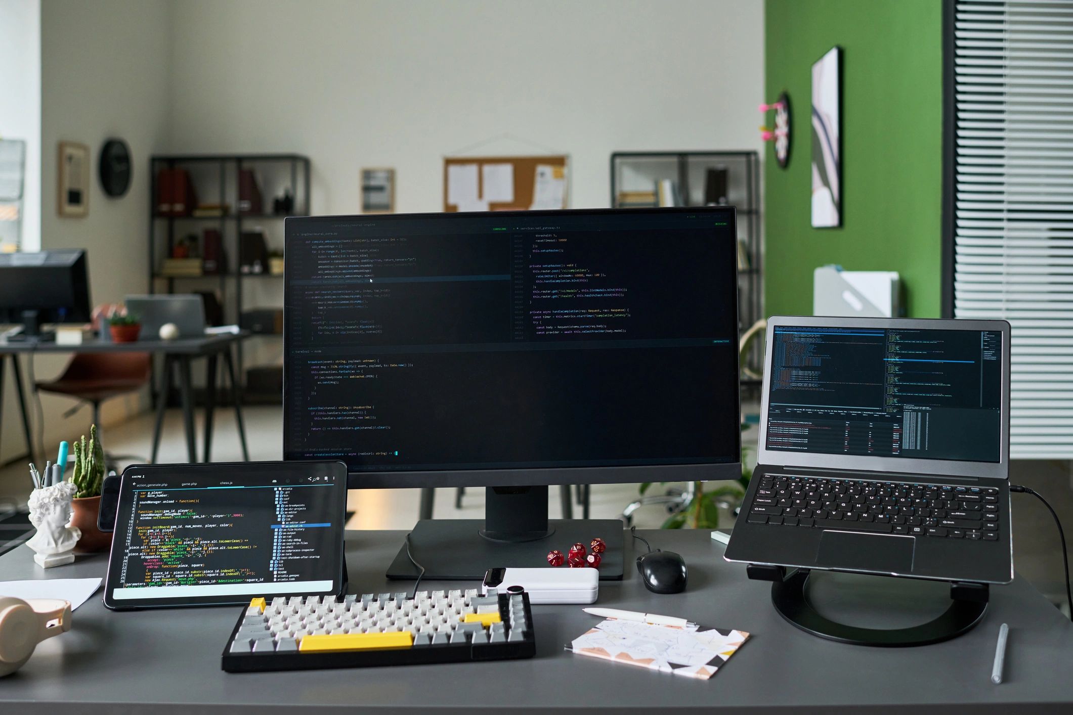 Technology workspace with screens displaying software and data